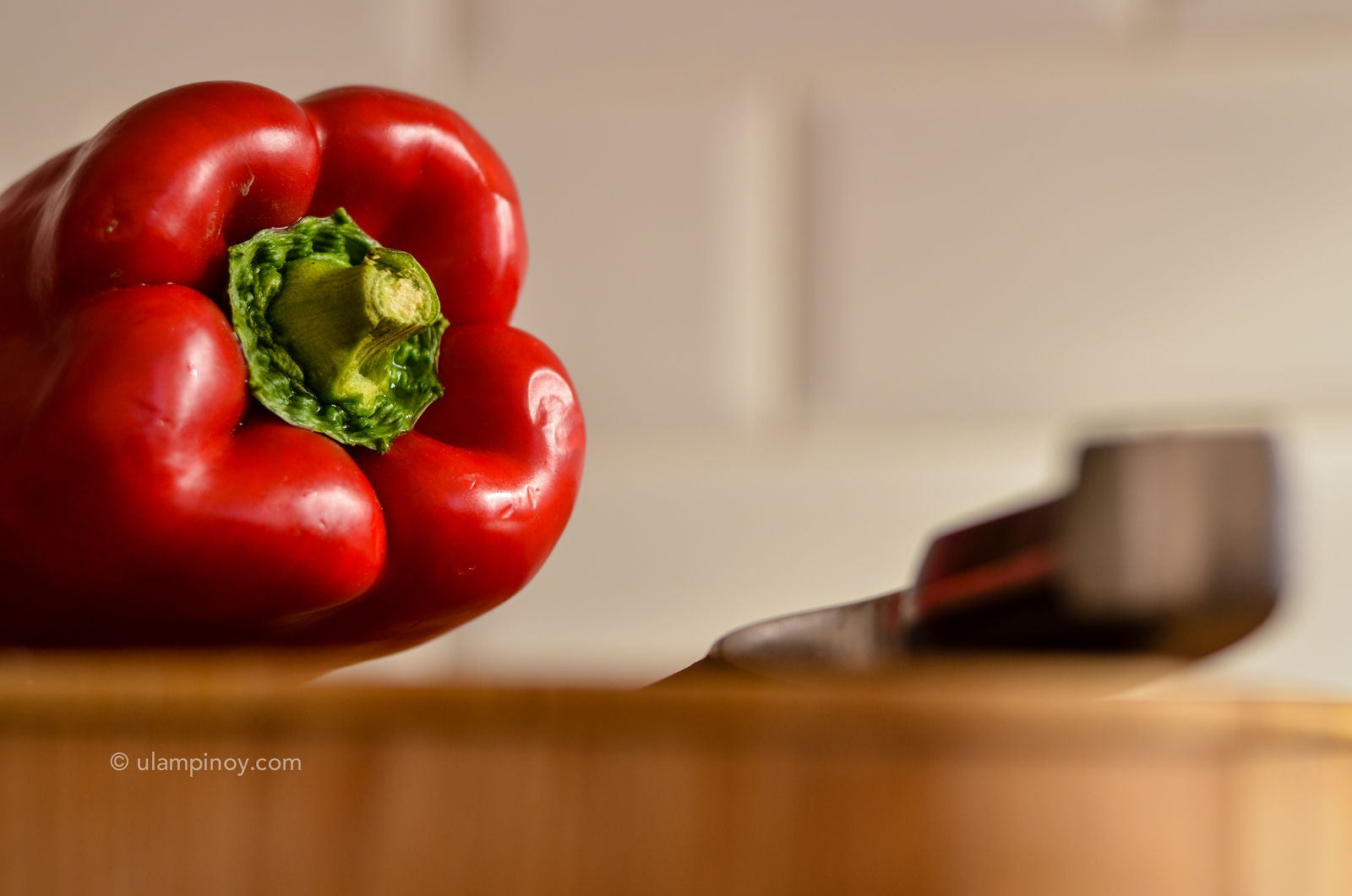 Red bell pepper on chopping board