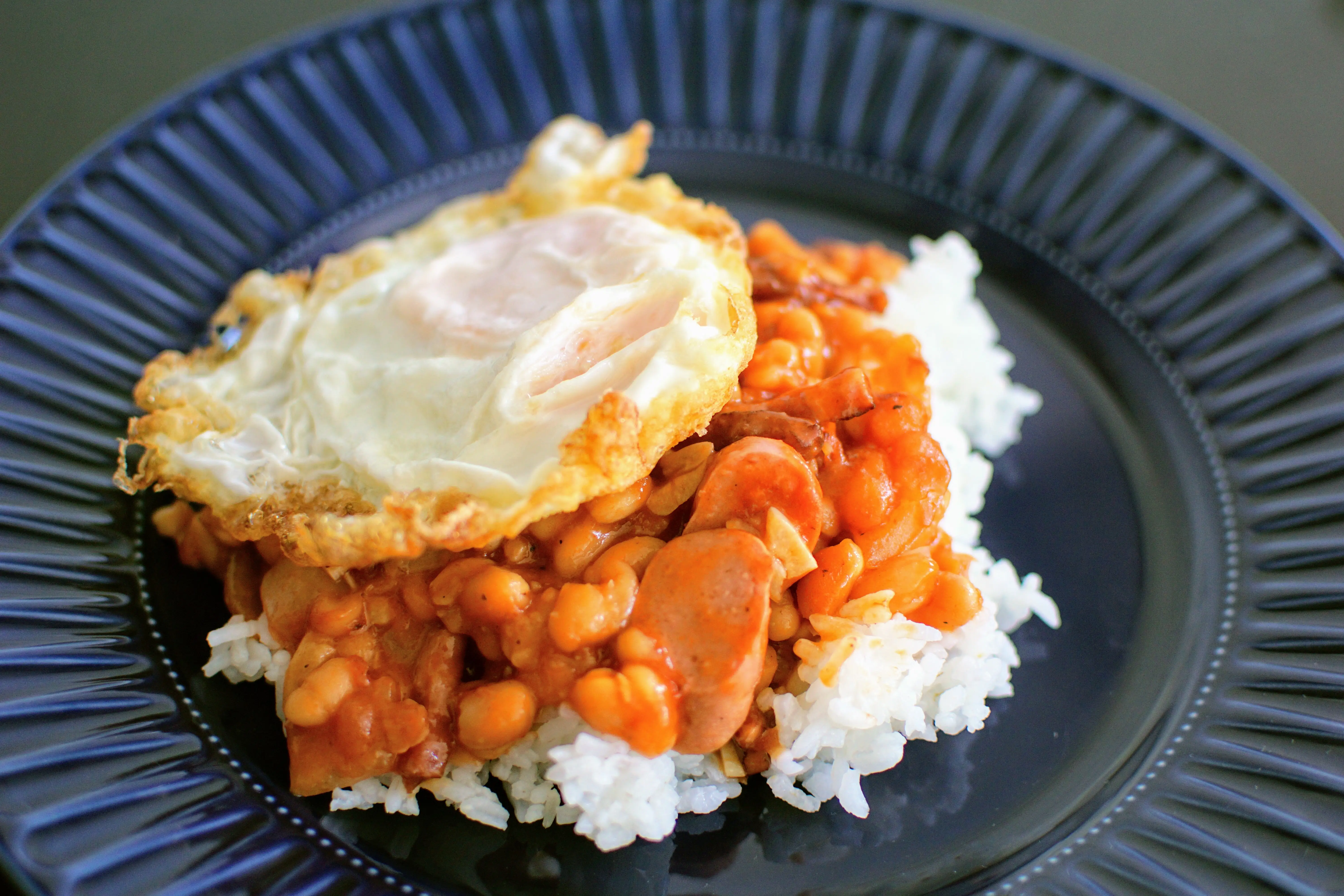 Serving Suggestion: Crispy Fried Egg with garlic rice and meat